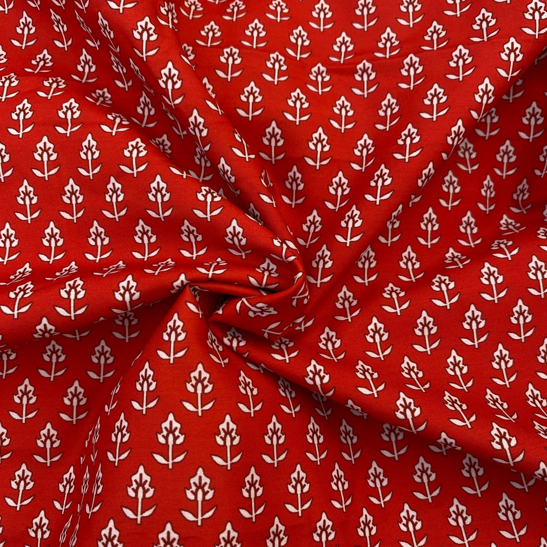Small print on red poly muslin fabric per meter - indiefabstore