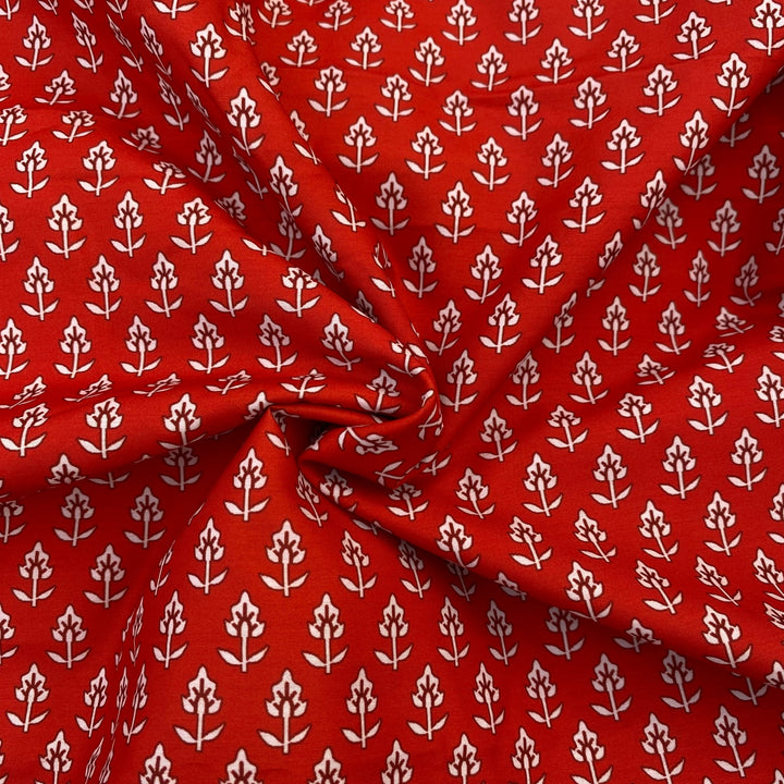 Small print on red poly muslin fabric per meter - indiefabstore