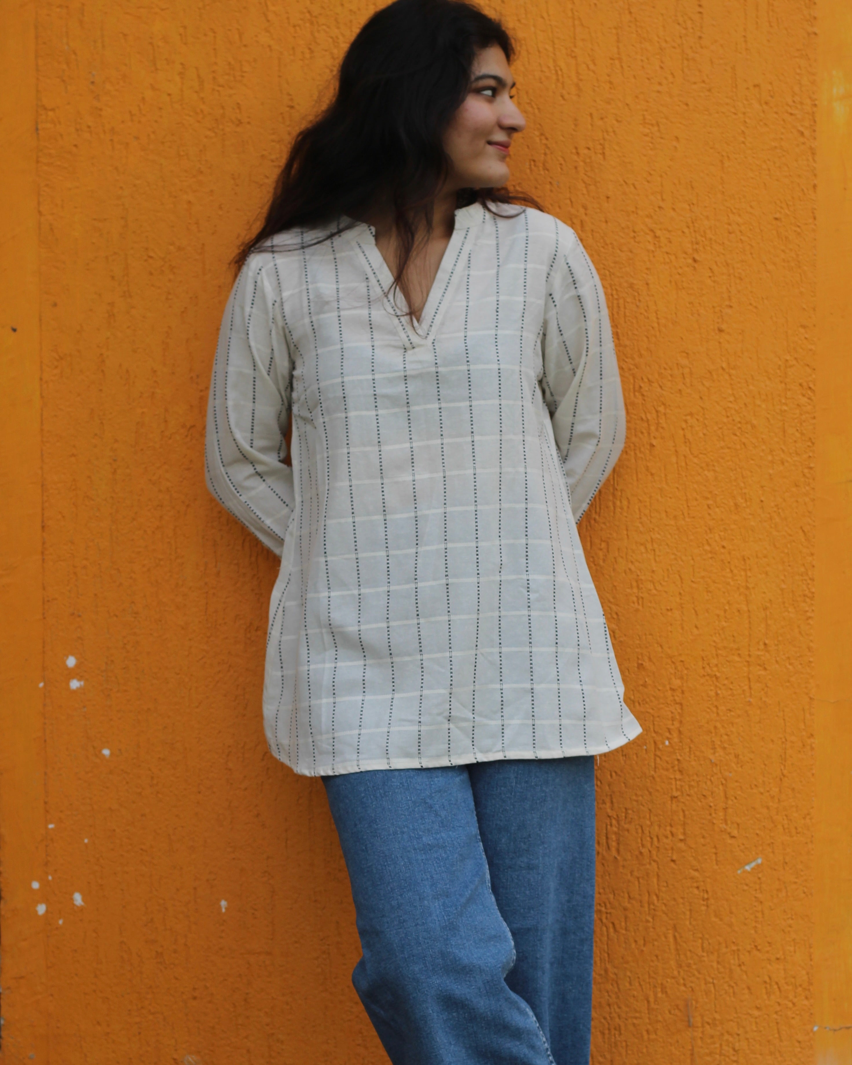 White handloom cotton short Kurta with V-neck and long sleeves, featuring elegant stripes, perfect for pairing with jeans