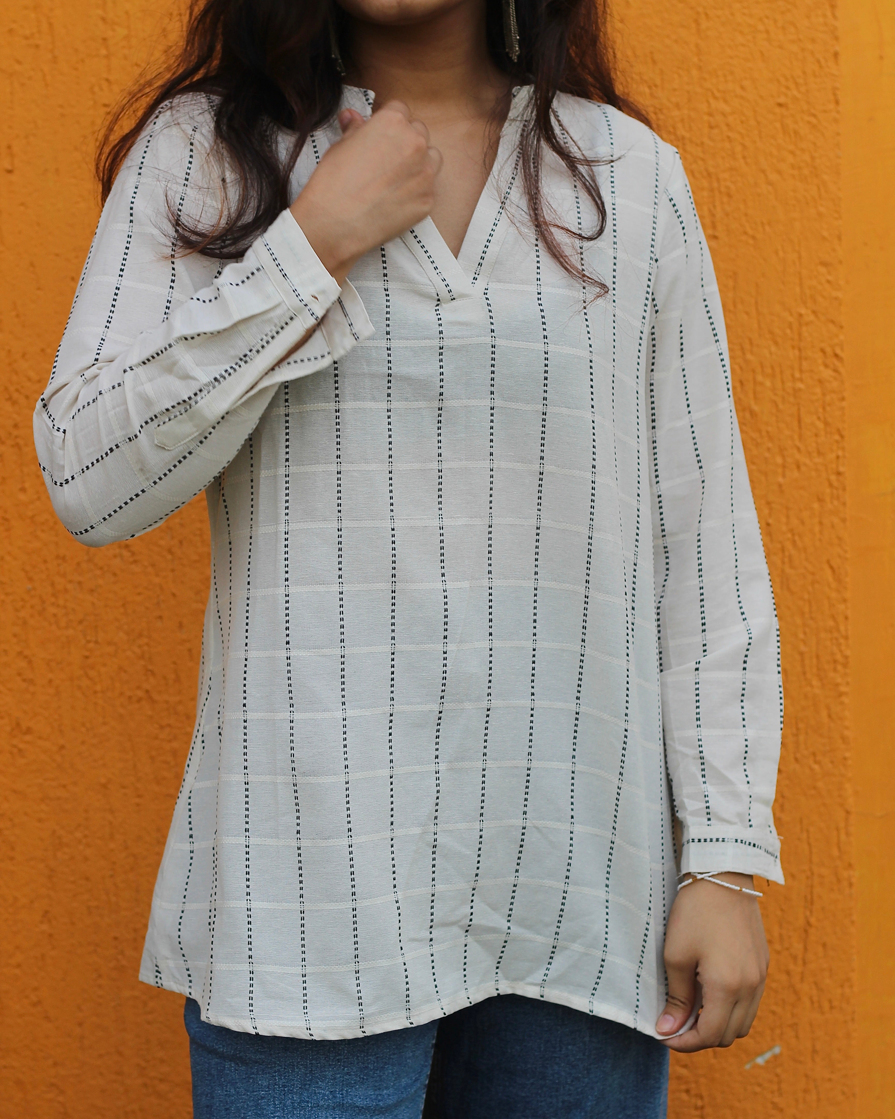 White handloom cotton short Kurta with V-neck and long sleeves, featuring elegant stripes, perfect for pairing with jeans