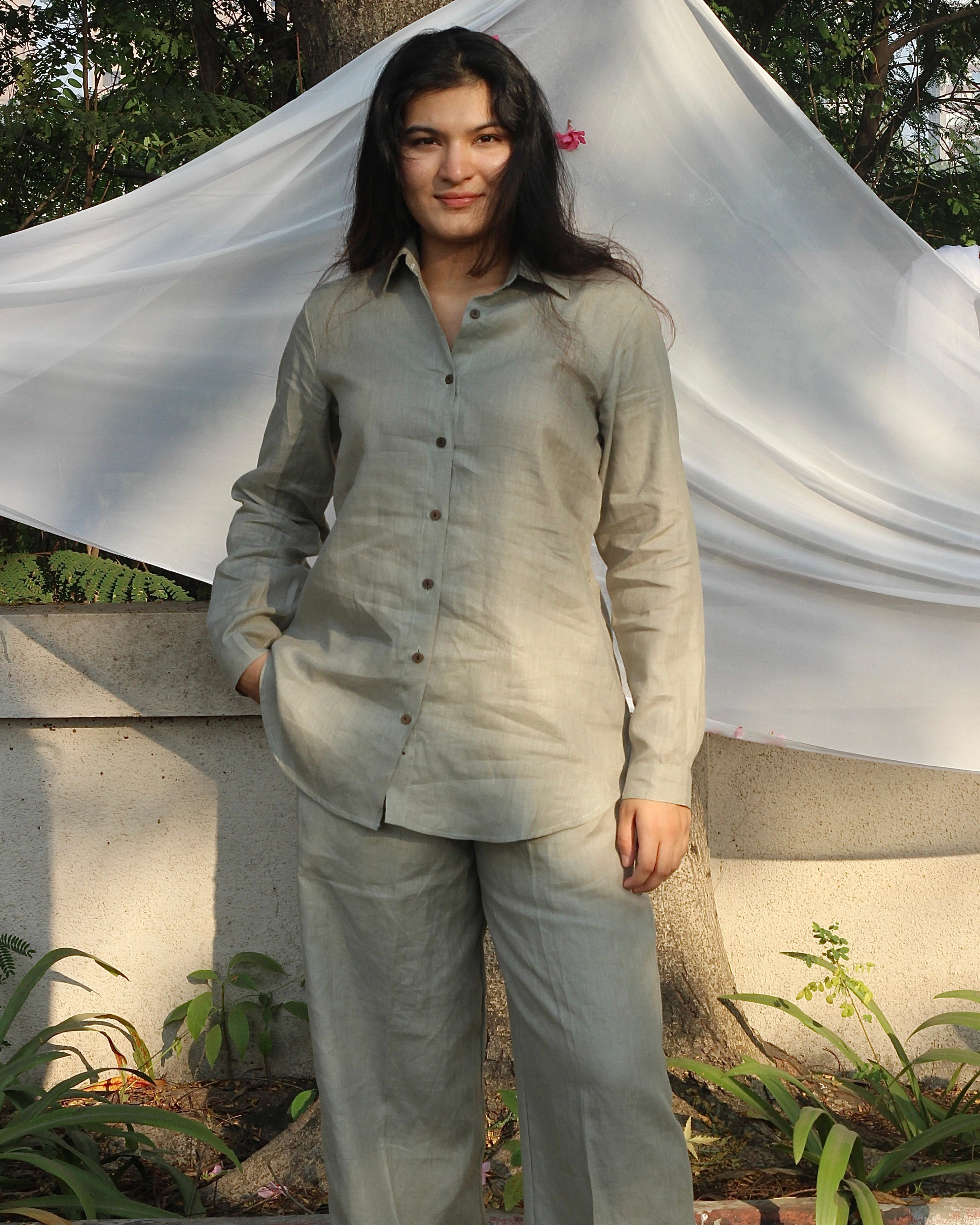 Detail shot of the linen co-ord set's top and bottom, showcasing the craftsmanship and relaxed fit of the green cord set