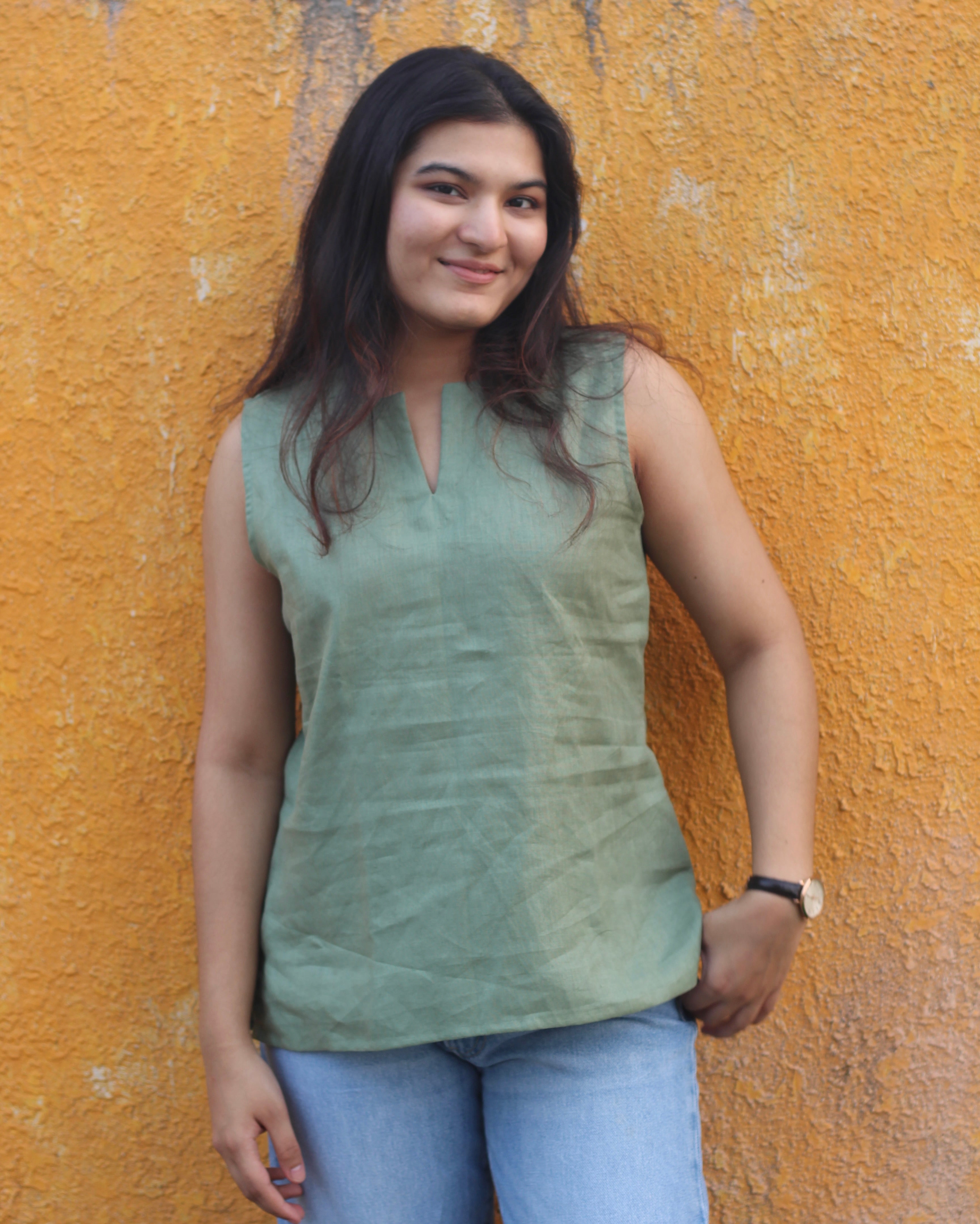 Premium linen sleeveless short kurta in Sage green, perfect for pairing with wide leg jeans for a brunch or casual workwear