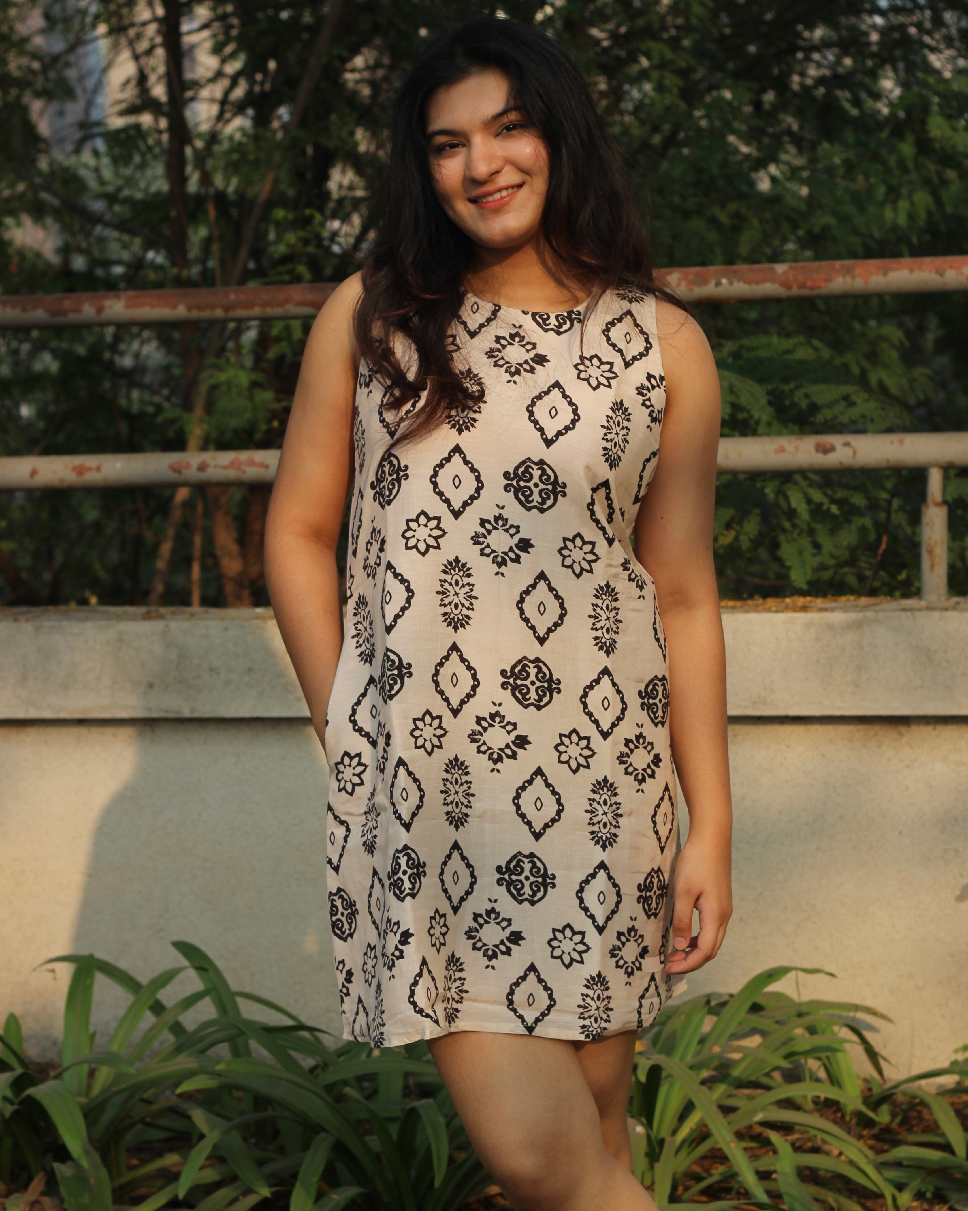 Modern Ajrakh print summer dress in pure muslin fabric, featuring a classy black print on a white base, sleeveless design, and cotton lining