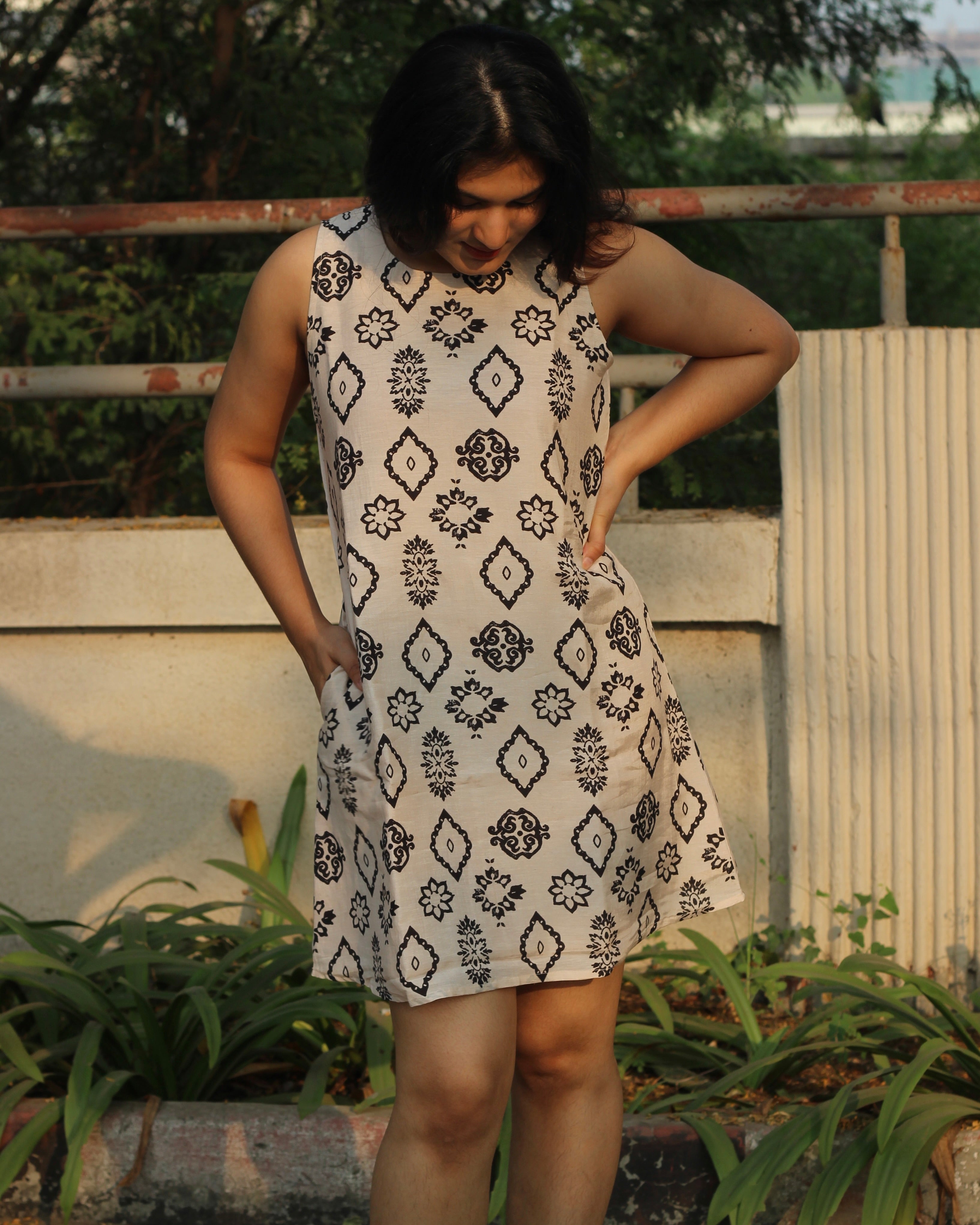 Modern Ajrakh print summer dress in pure muslin fabric, featuring a classy black print on a white base, sleeveless design, and cotton lining