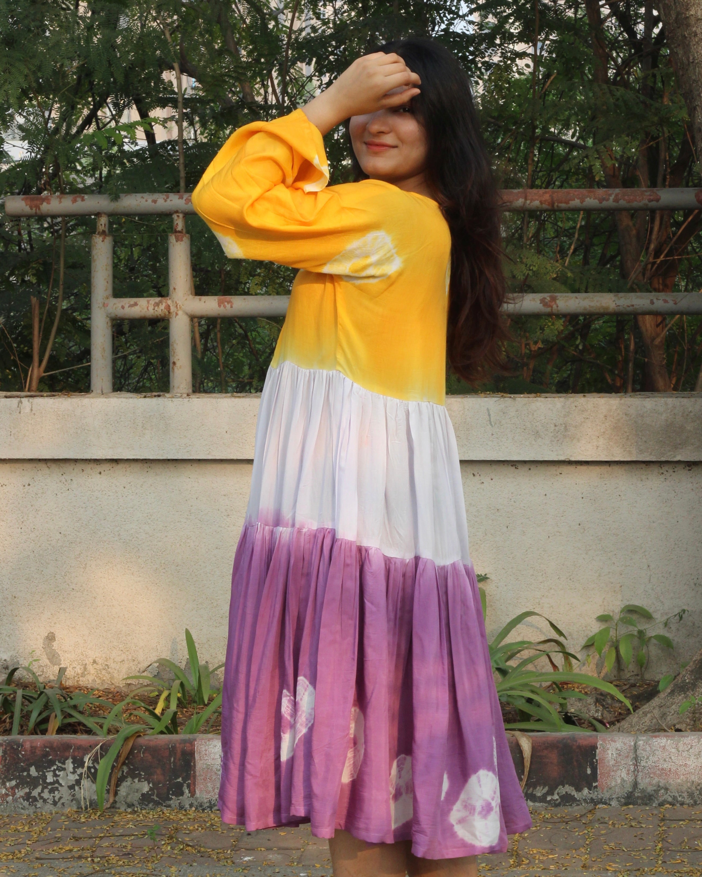 tye and dye muslin long dress_4Lilac, yellow, and white bandhani print dress on a model, showcasing the intricate tie and dye design on pure muslin fabric_4