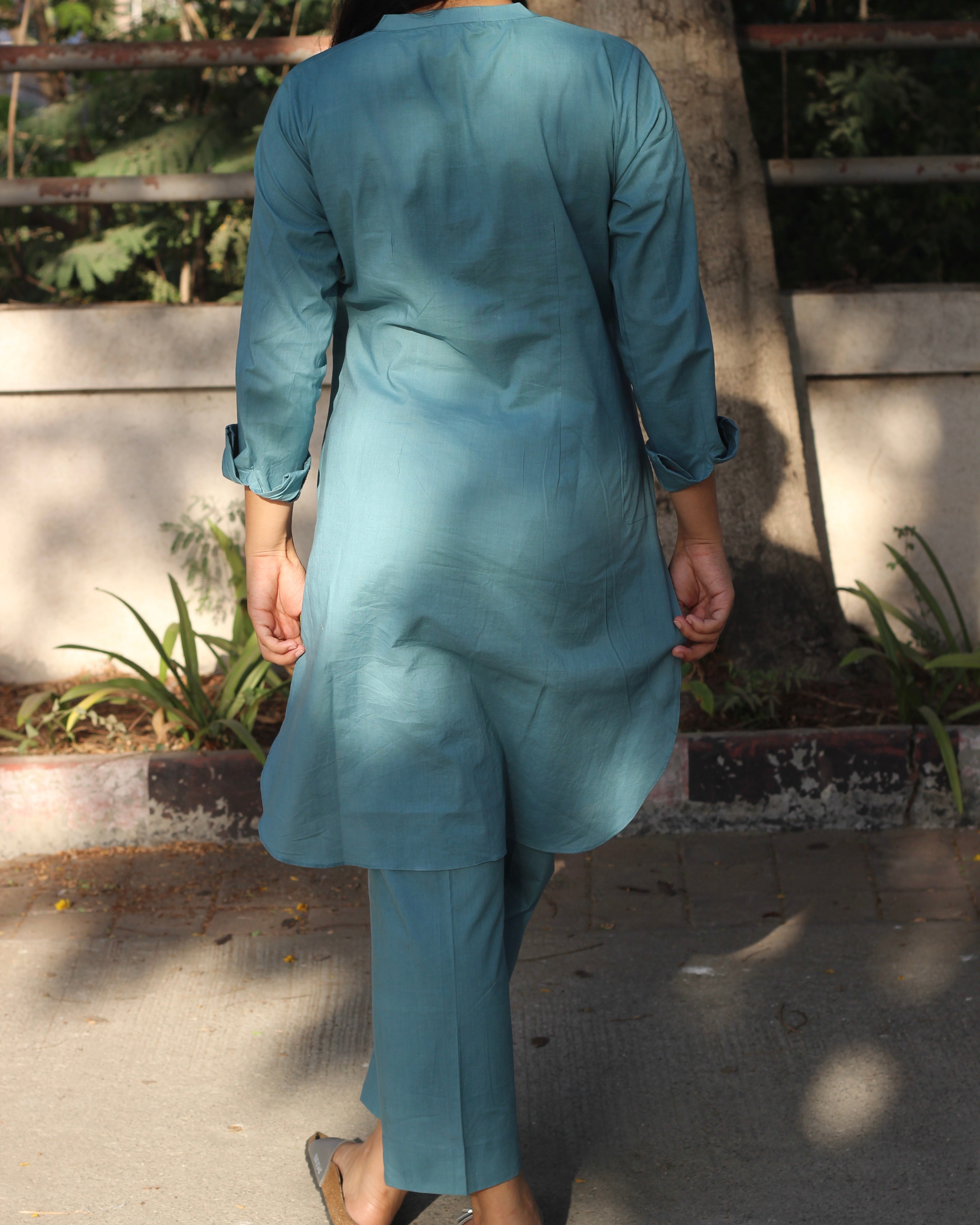 Pure Cambric Cotton Powder Blue Co-ord set featuring a long kurta with round side cuts and brown neck buttons, paired with soft and comfortable pants, ideal for versatile summer wear