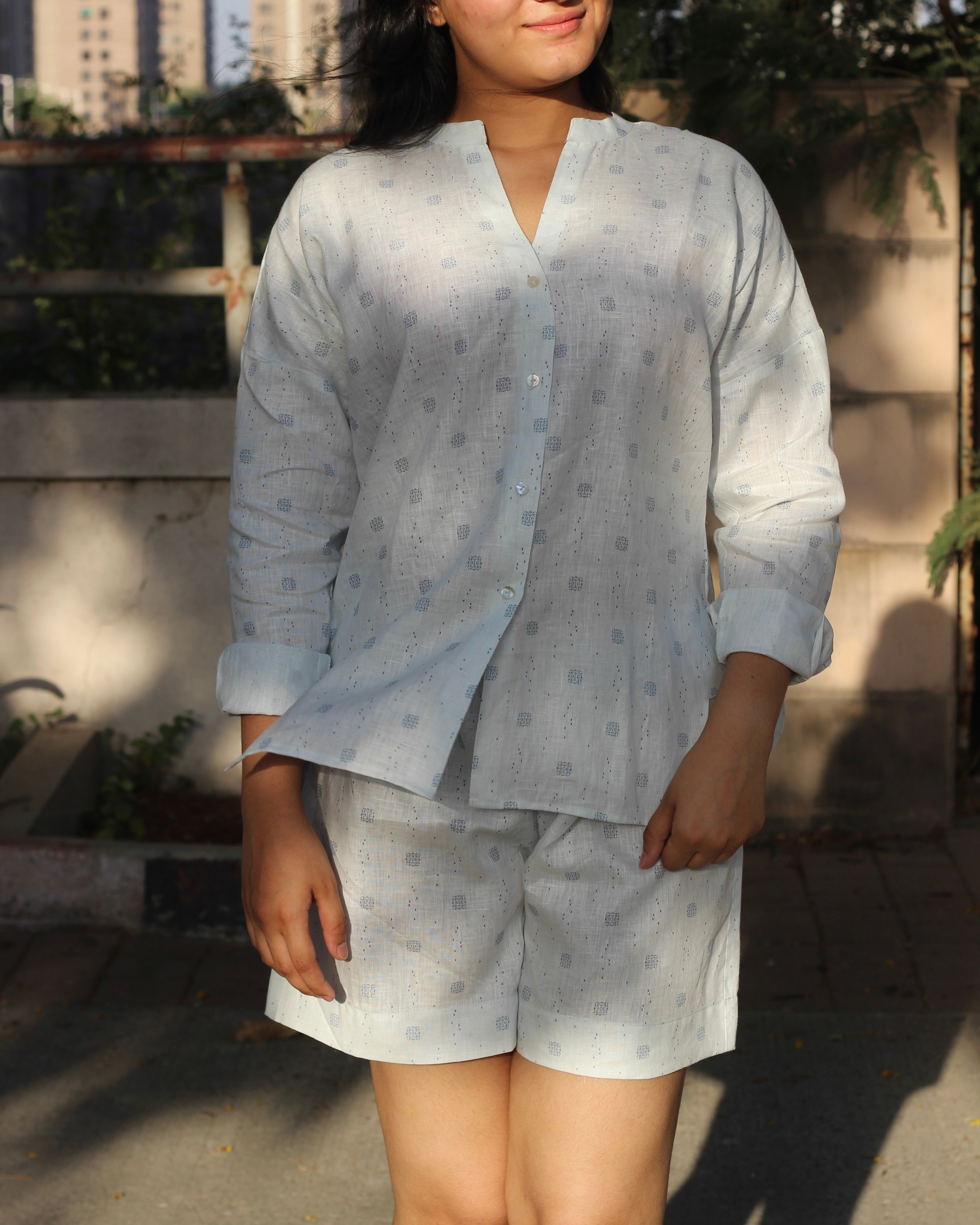 Premium Linen Abstract Printed Co-ord featuring a white V-neck shirt with stylish side cuts and matching shorts, ideal for a light and breezy summer day