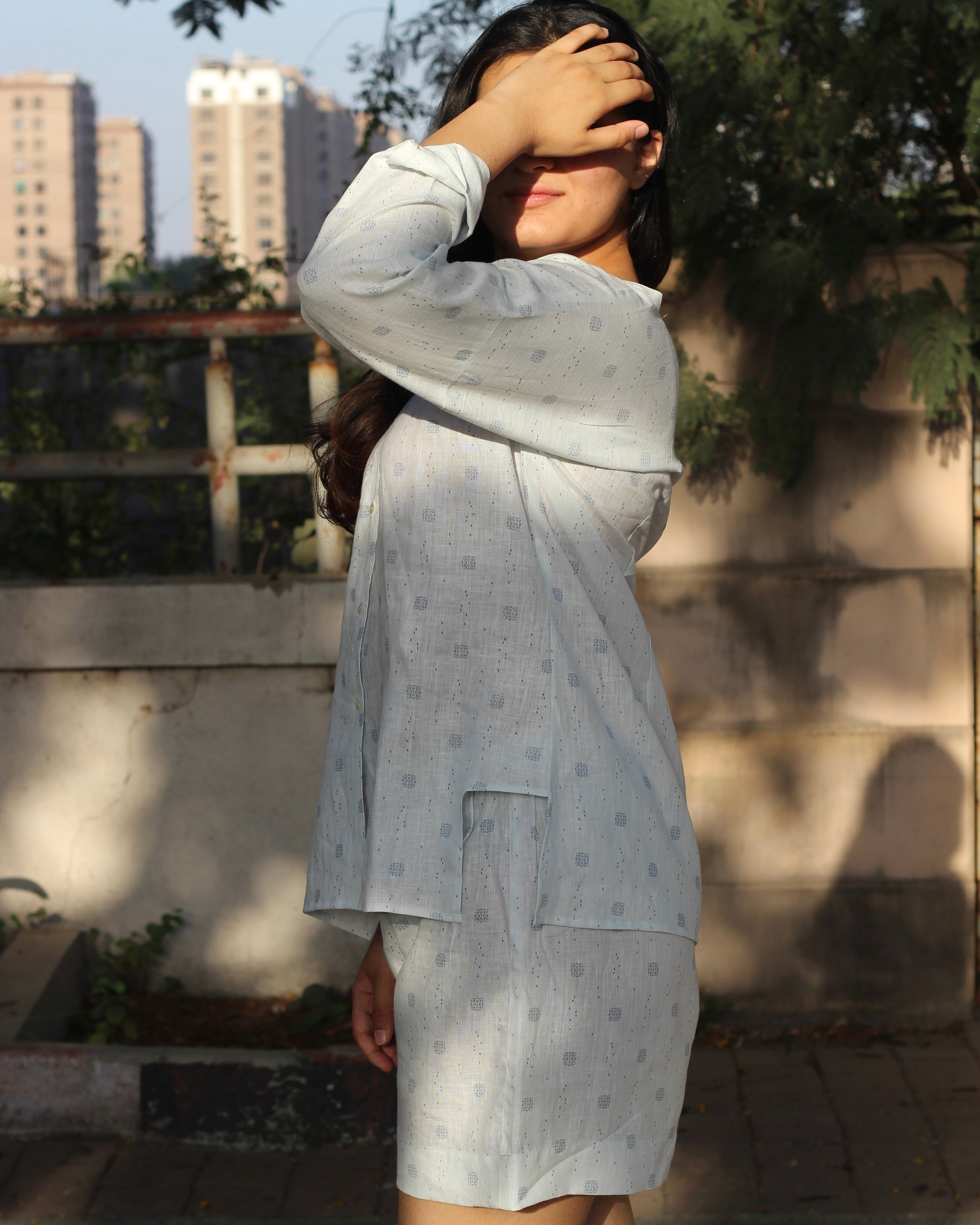 Premium Linen Abstract Printed Co-ord featuring a white V-neck shirt with stylish side cuts and matching shorts, ideal for a light and breezy summer day