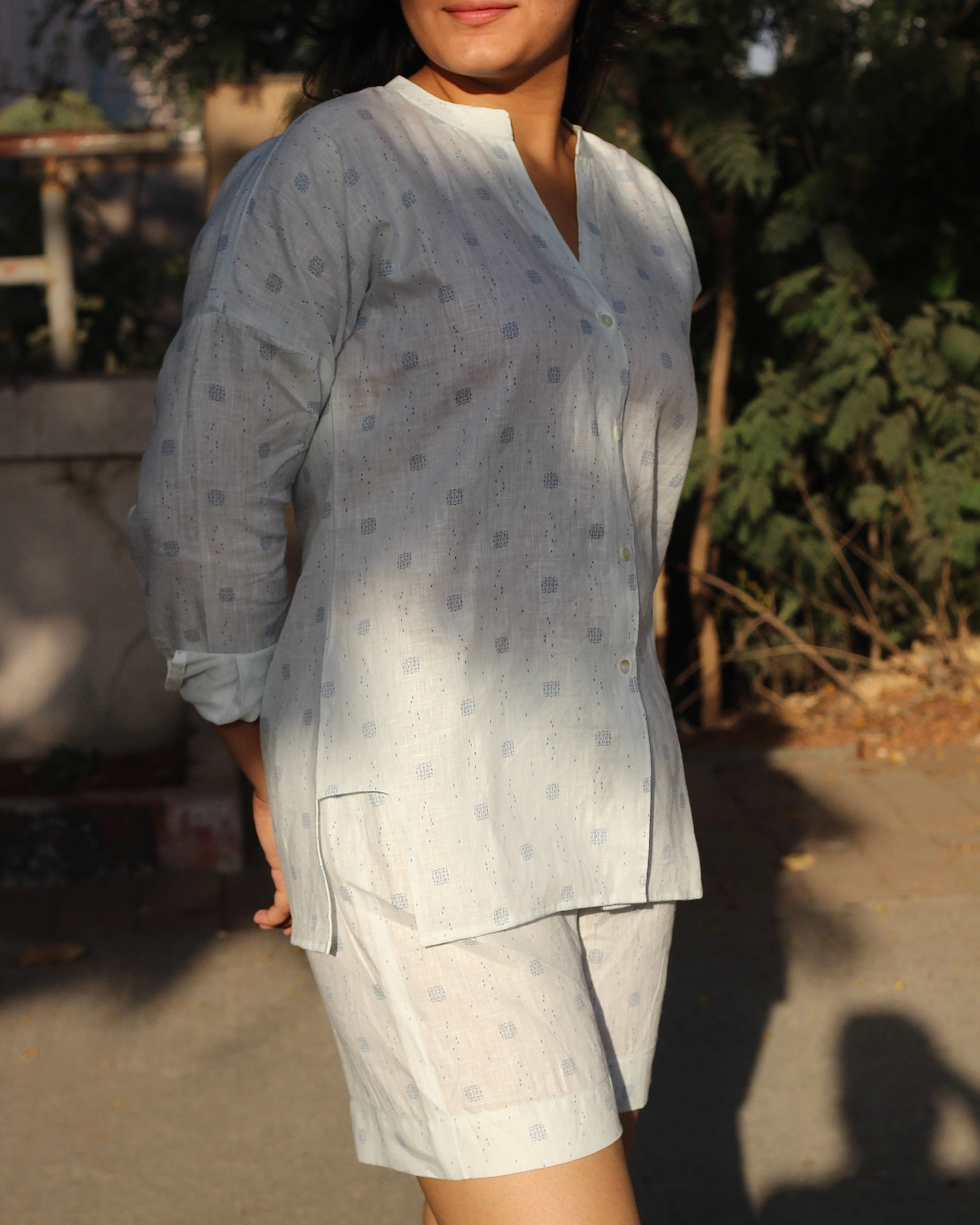 Premium Linen Abstract Printed Co-ord featuring a white V-neck shirt with stylish side cuts and matching shorts, ideal for a light and breezy summer day