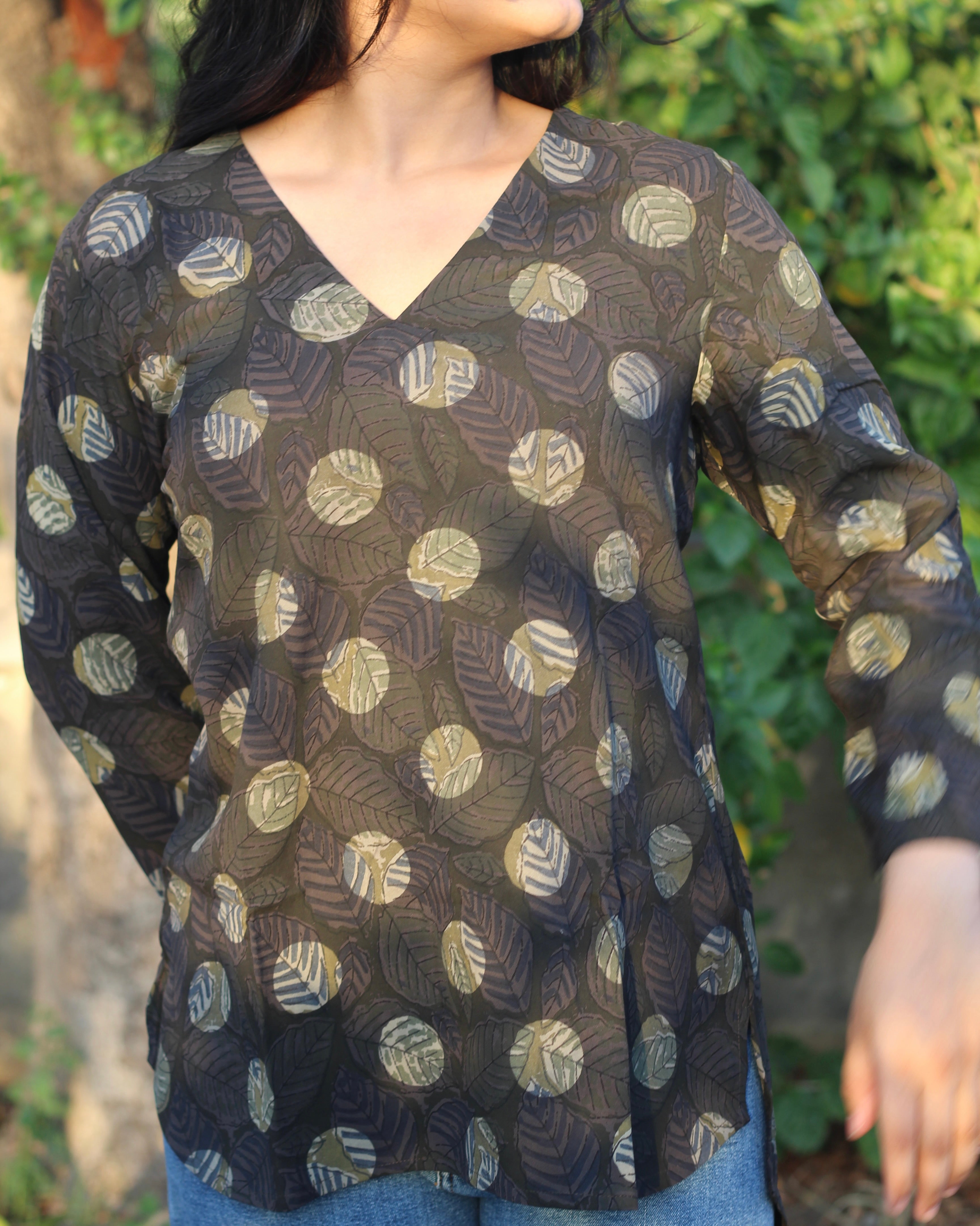 Stylish brown printed short kurta with dark contrasting lead print, featuring a V-neck, 3/4 sleeves, and small side cuts for a chic look