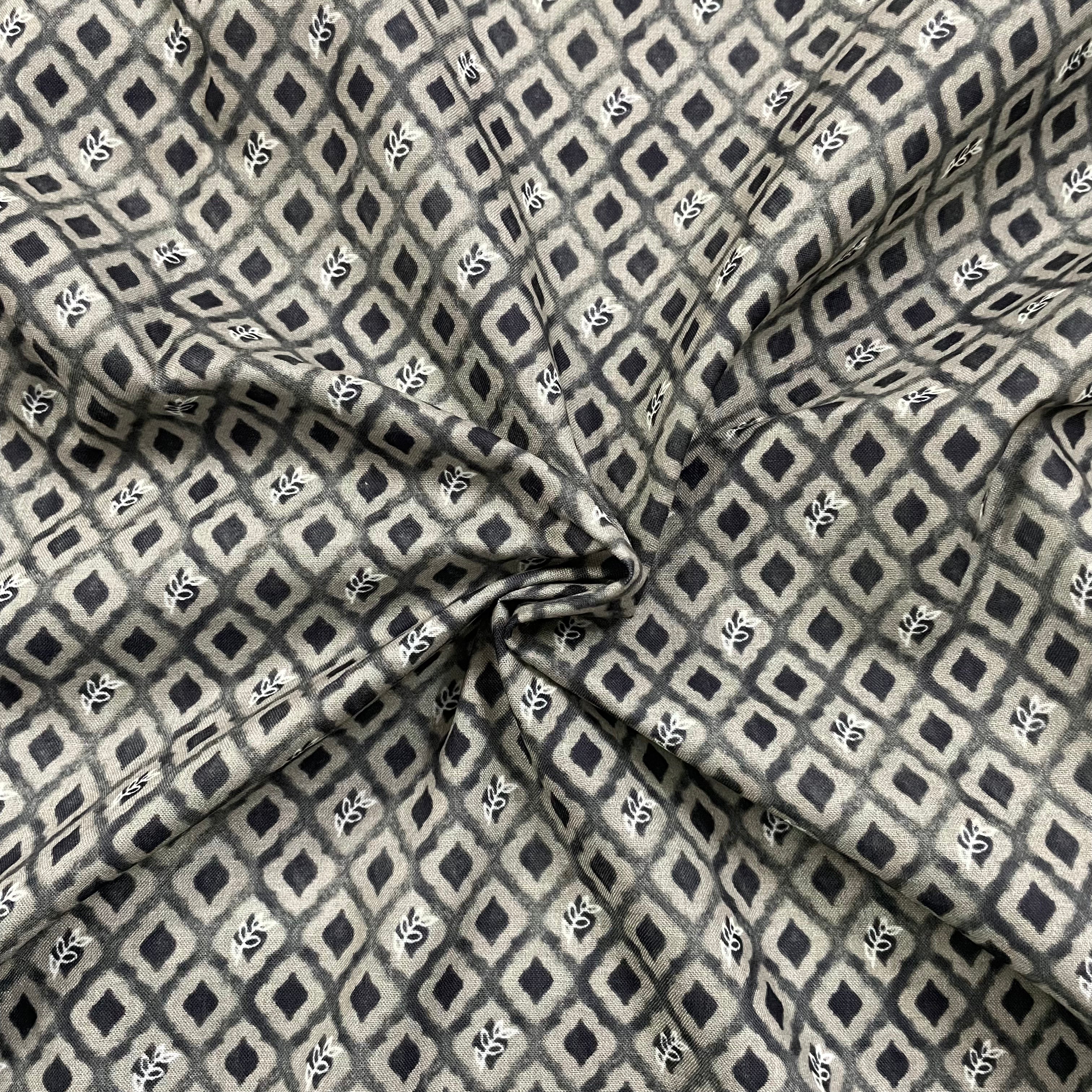 Small green and black contrast print on mul cotton fabric