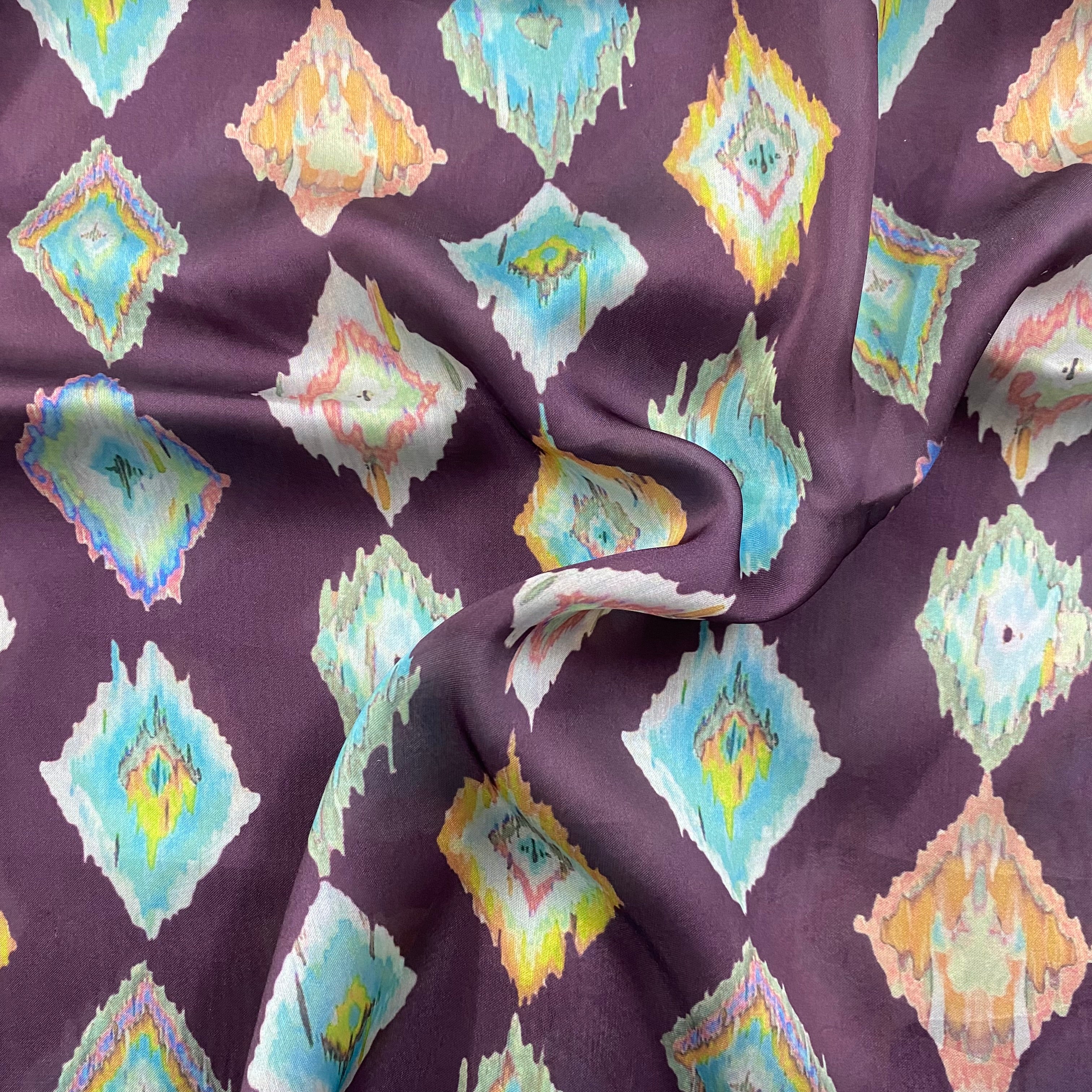 Ikkat print on purple georgette satin fabric per meter