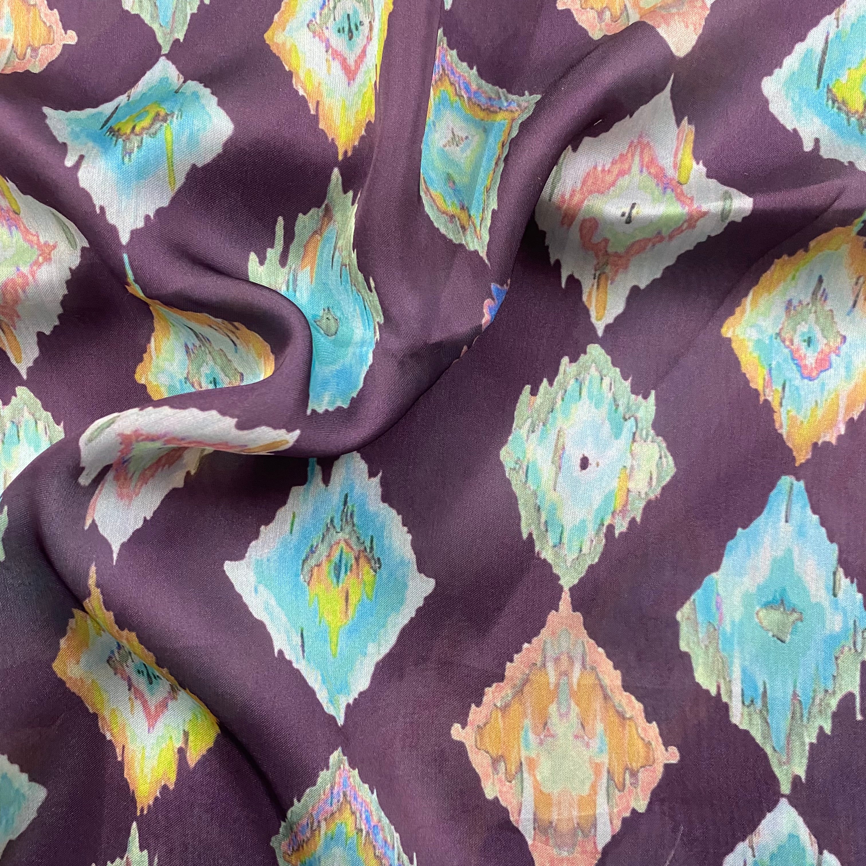 Ikkat print on purple georgette satin fabric per meter