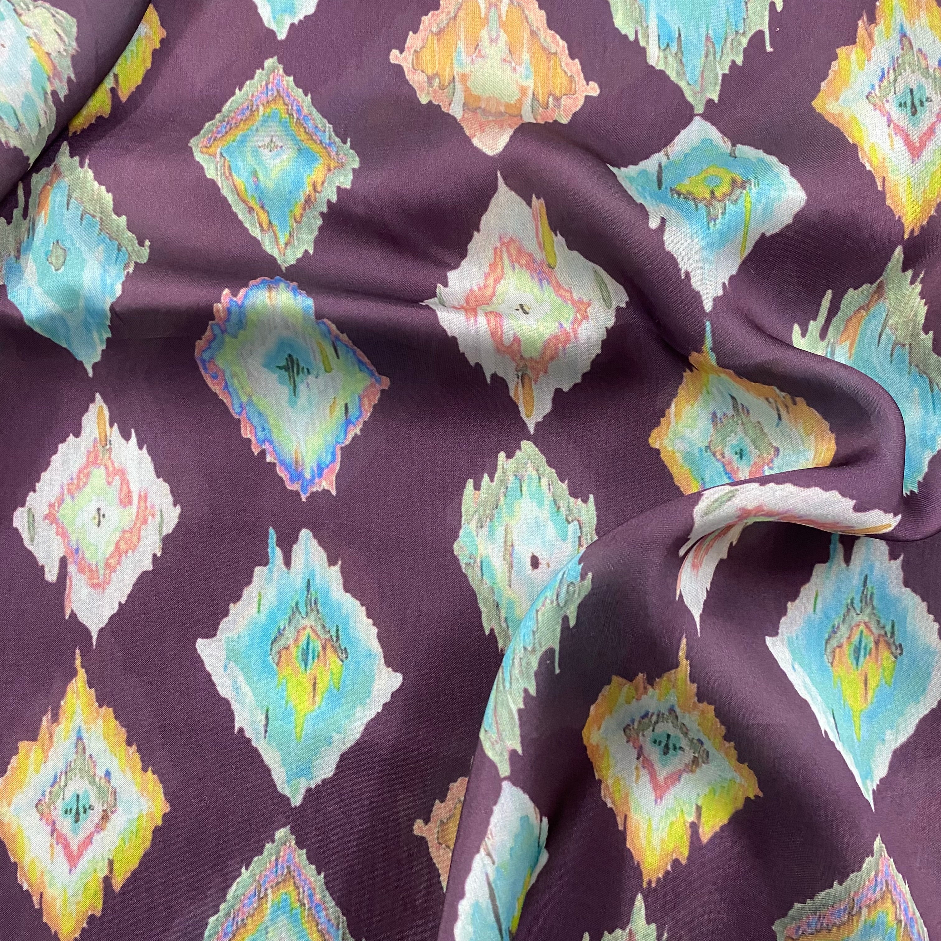 Ikkat print on purple georgette satin fabric per meter