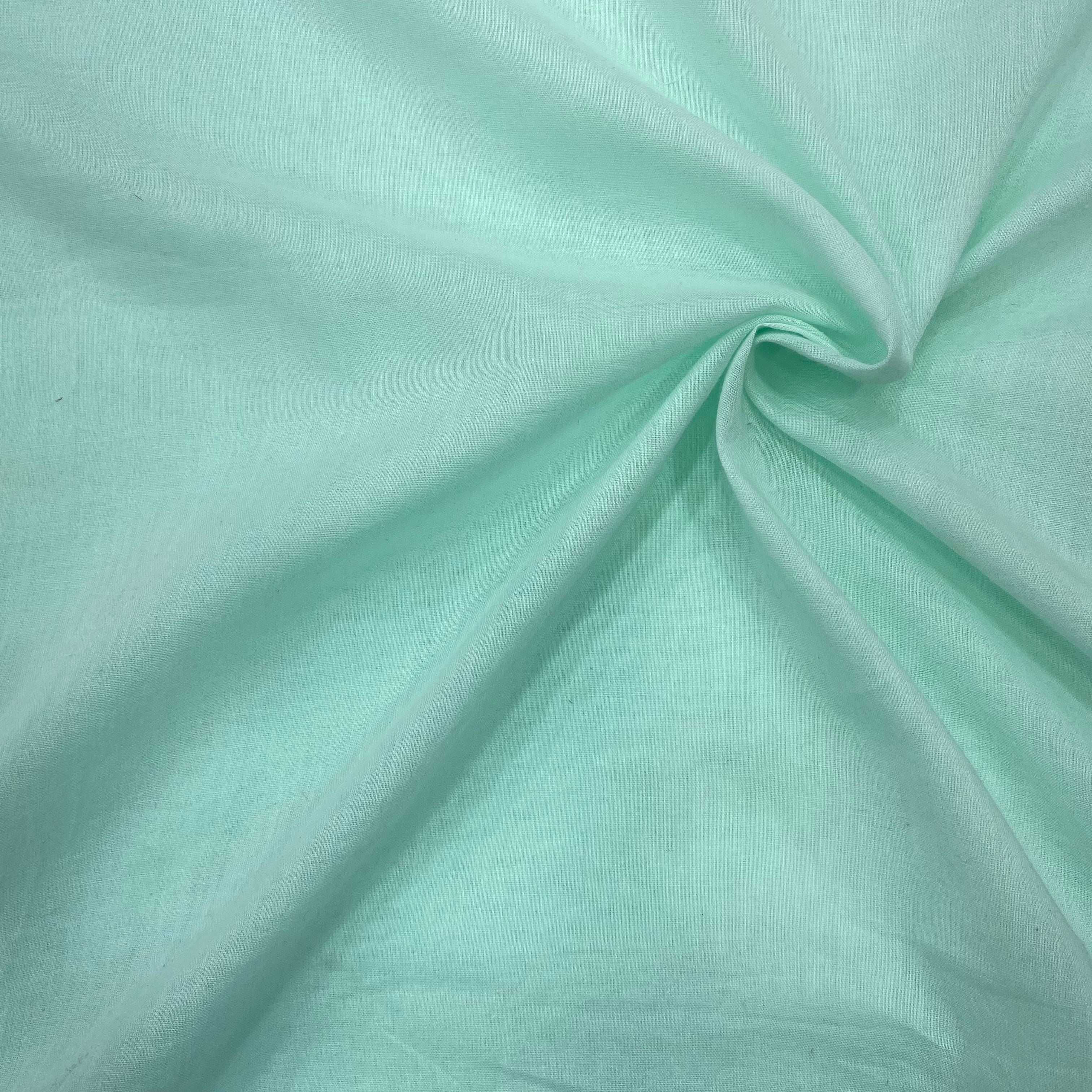 Folded layers of sky blue fabric, emphasizing the softness and quality