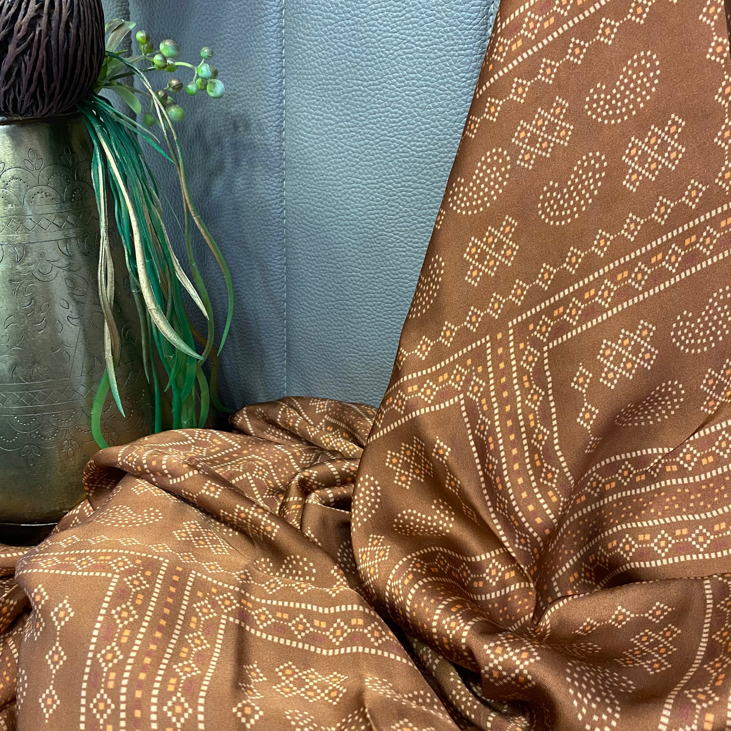 Paisley Motif print on brown shaded modal satin fabric per meter