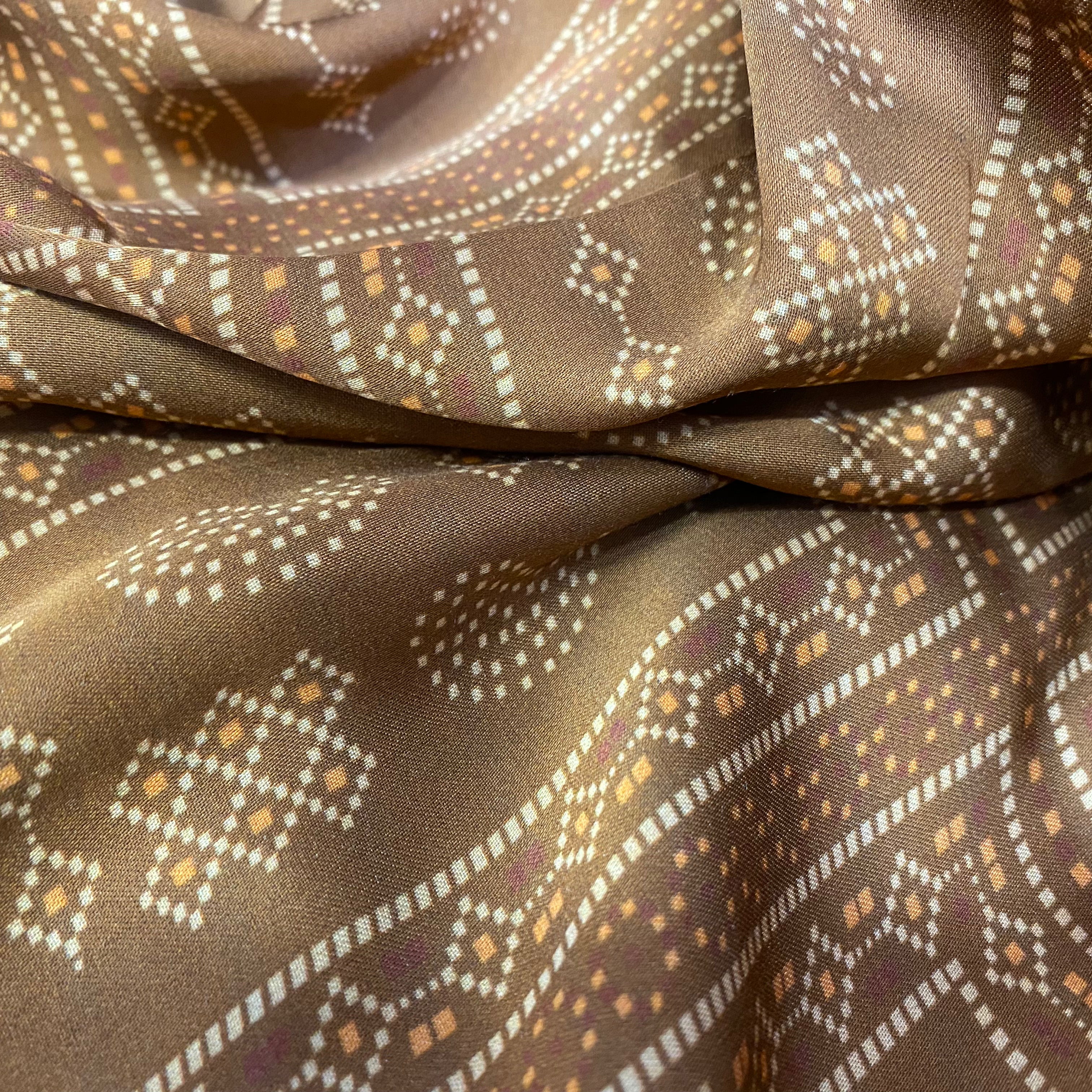 Paisley Motif print on brown shaded modal satin fabric per meter