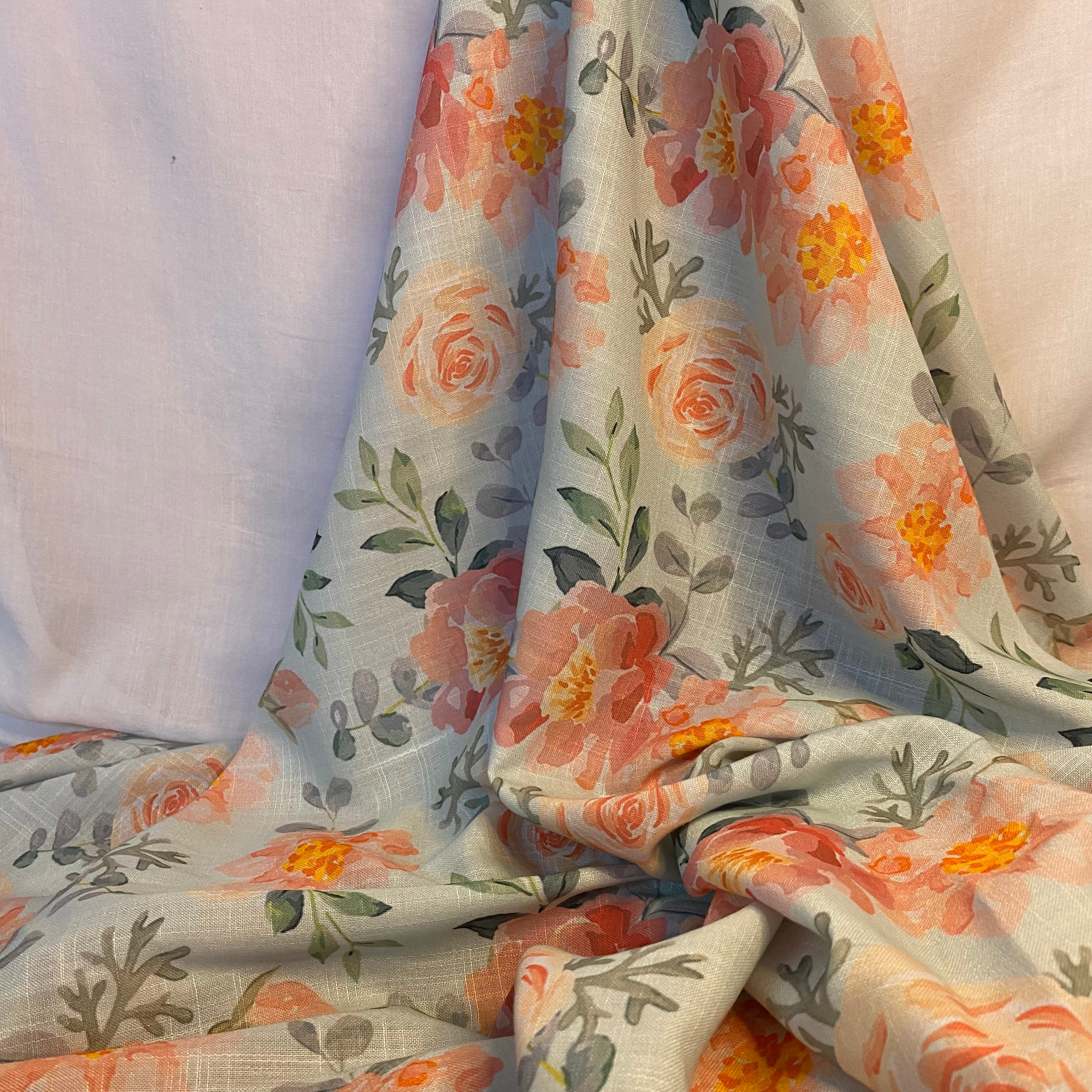 Graceful floral print on sky blue Cotton-Linen fabric per meter