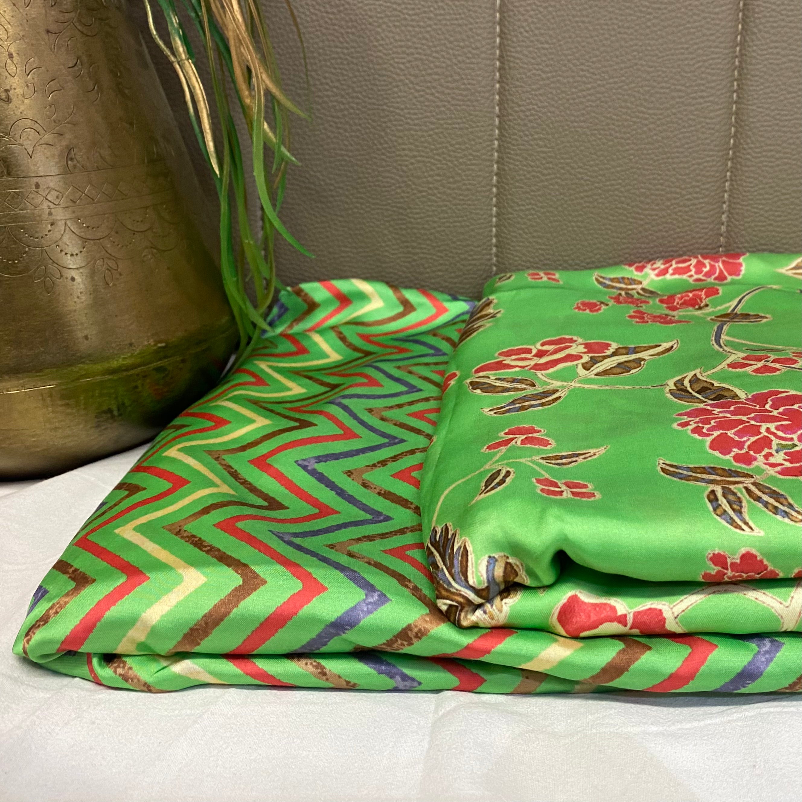 Green top and bottom with multicoloured floral pattern on top and zigzag bottom, per meter price