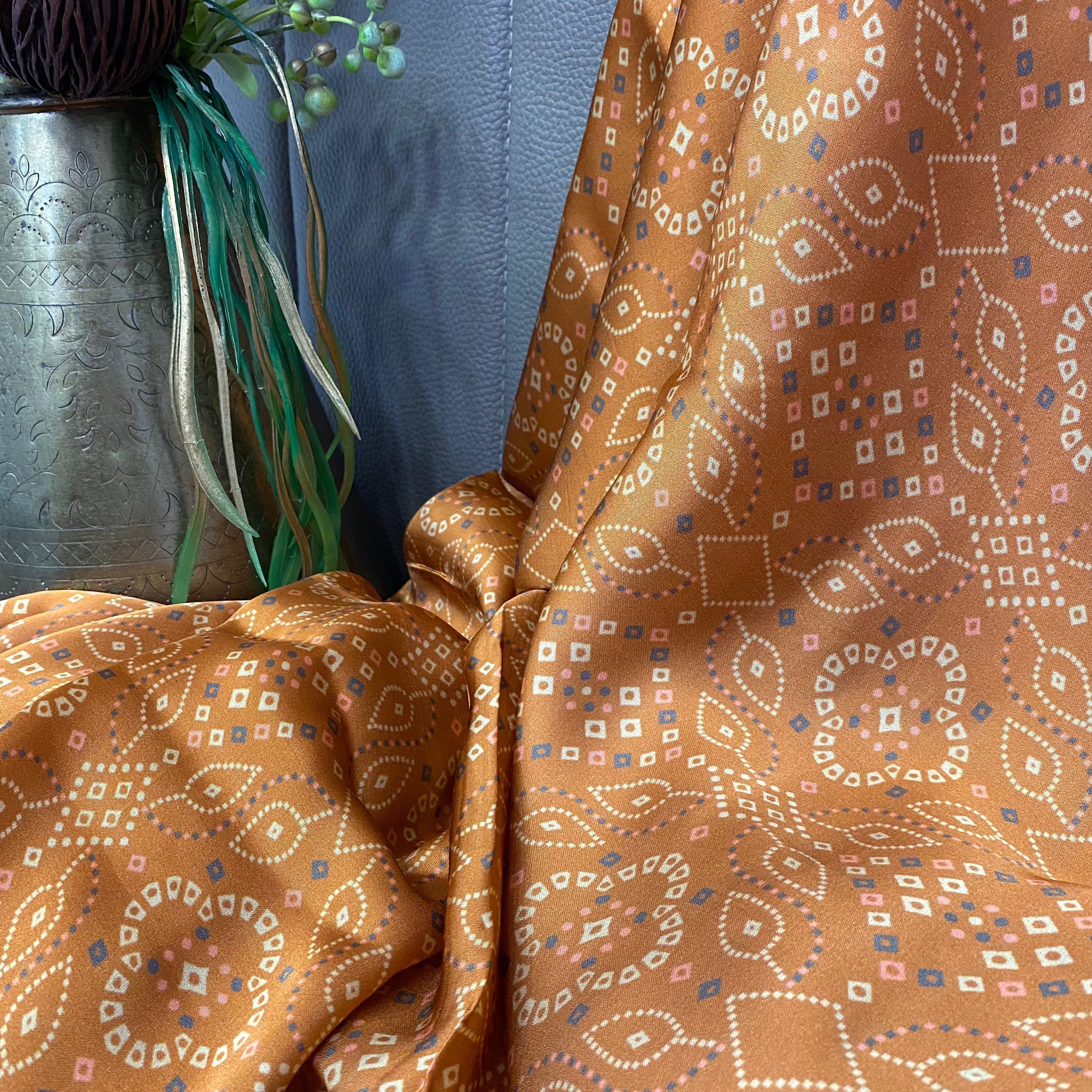 Abstract Indian Brown shade print on Modal Satin fabric per meter