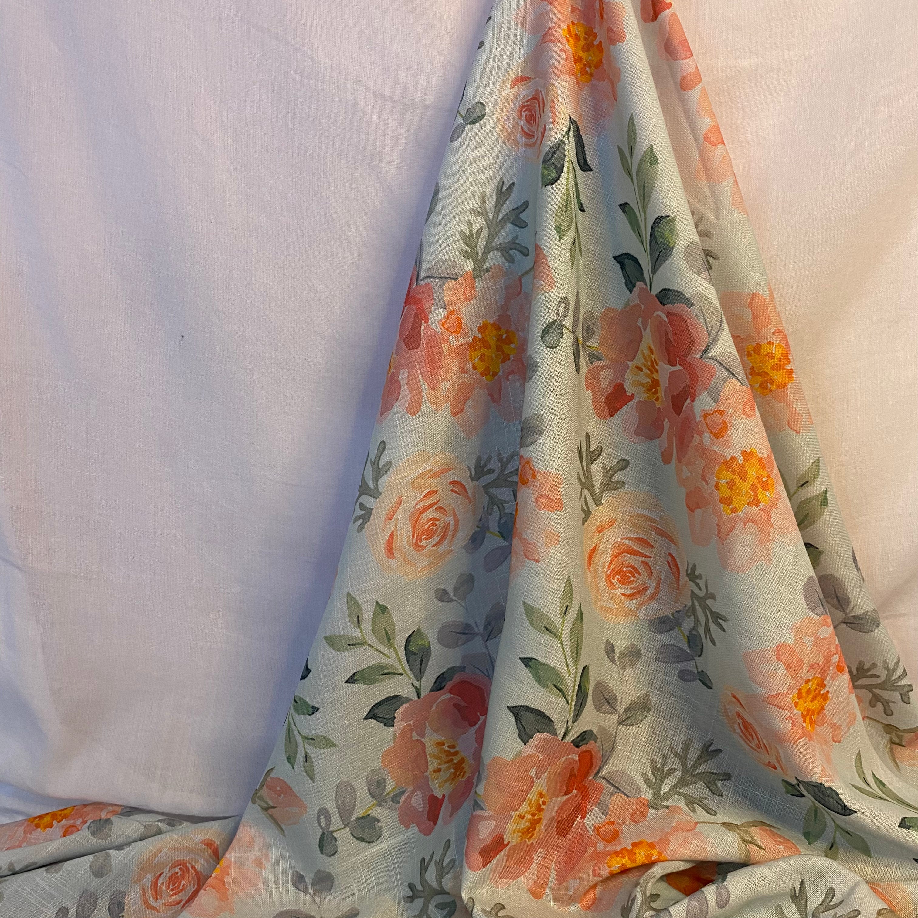 Graceful floral print on sky blue Cotton-Linen fabric per meter