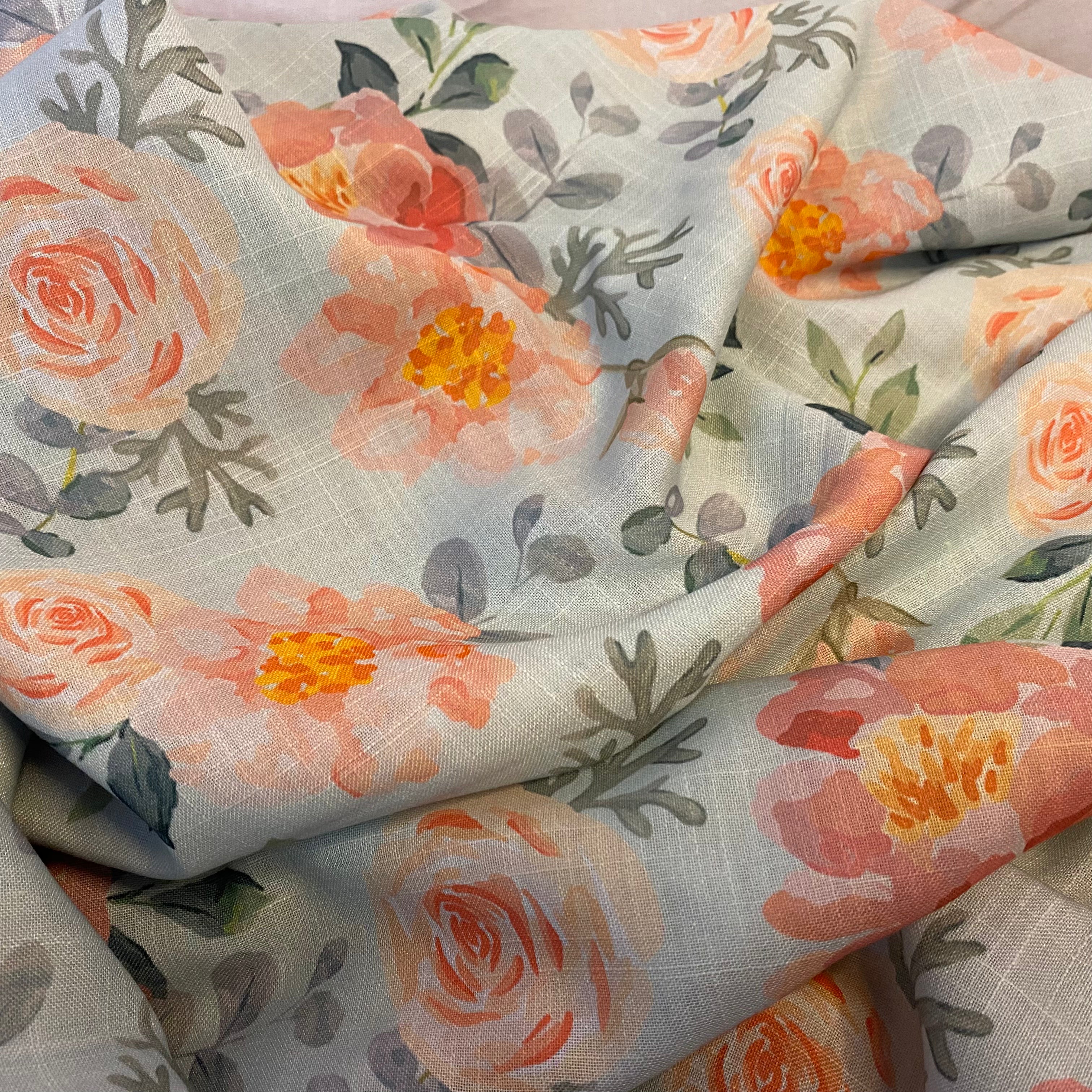 Graceful floral print on sky blue Cotton-Linen fabric per meter