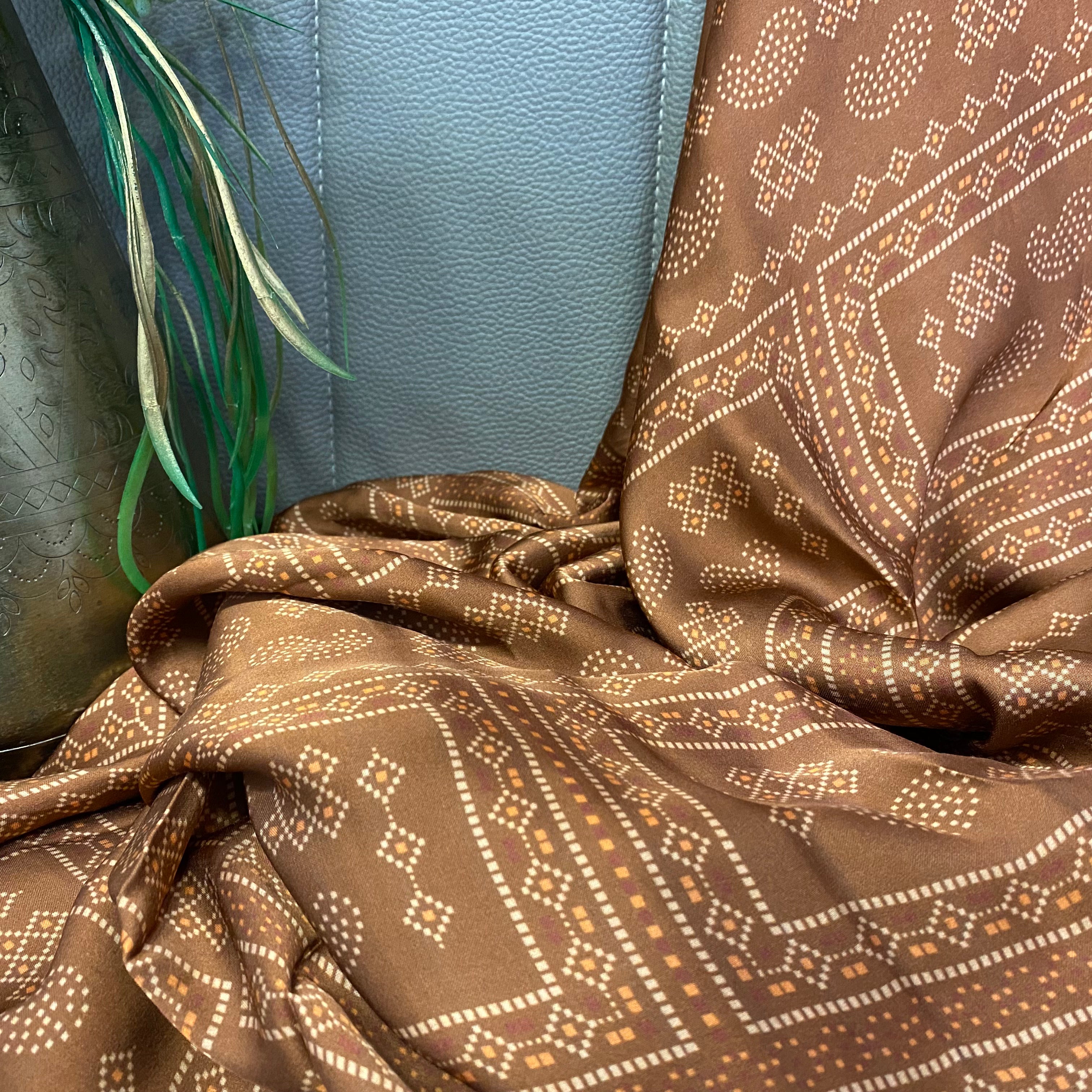 Paisley Motif print on brown shaded modal satin fabric per meter